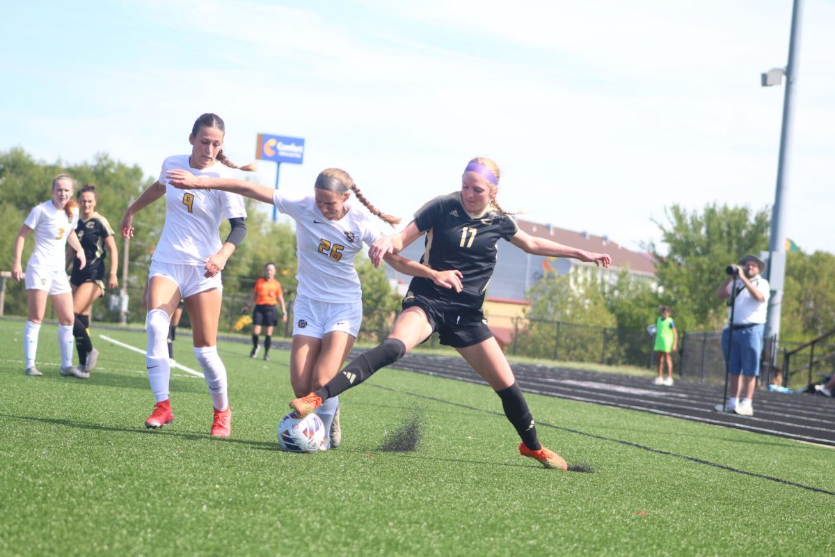 Senior Forward Anna Burnett stops Fort Hays opponent from advancing to the goal.&#160;