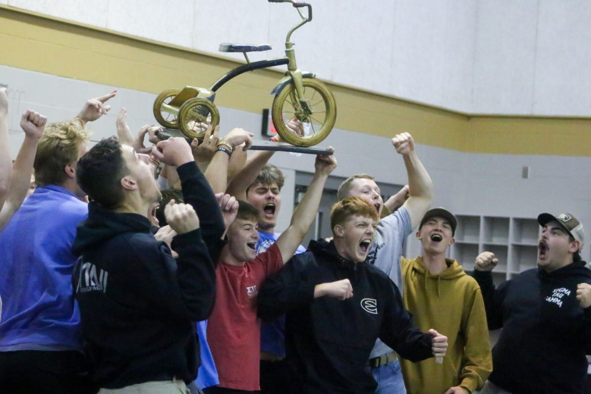 Winner of the tricycle&#160;races, Sigma Tau Gamma,&#160;hoist the winners cup after&#160;beating their opponent in the&#160;championship round.&#160;