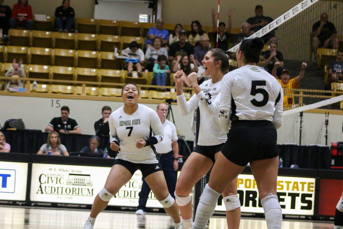 Outside hitter Sandora Sasaki (left), middle hitter Caydence Doebele (middle), and DS Tasiah Nunnery (right) celebrate after winning a point against University of Central Missouri on Oct. 21. The Hornets ended falling to the Jennies in a thrilling five set match.
