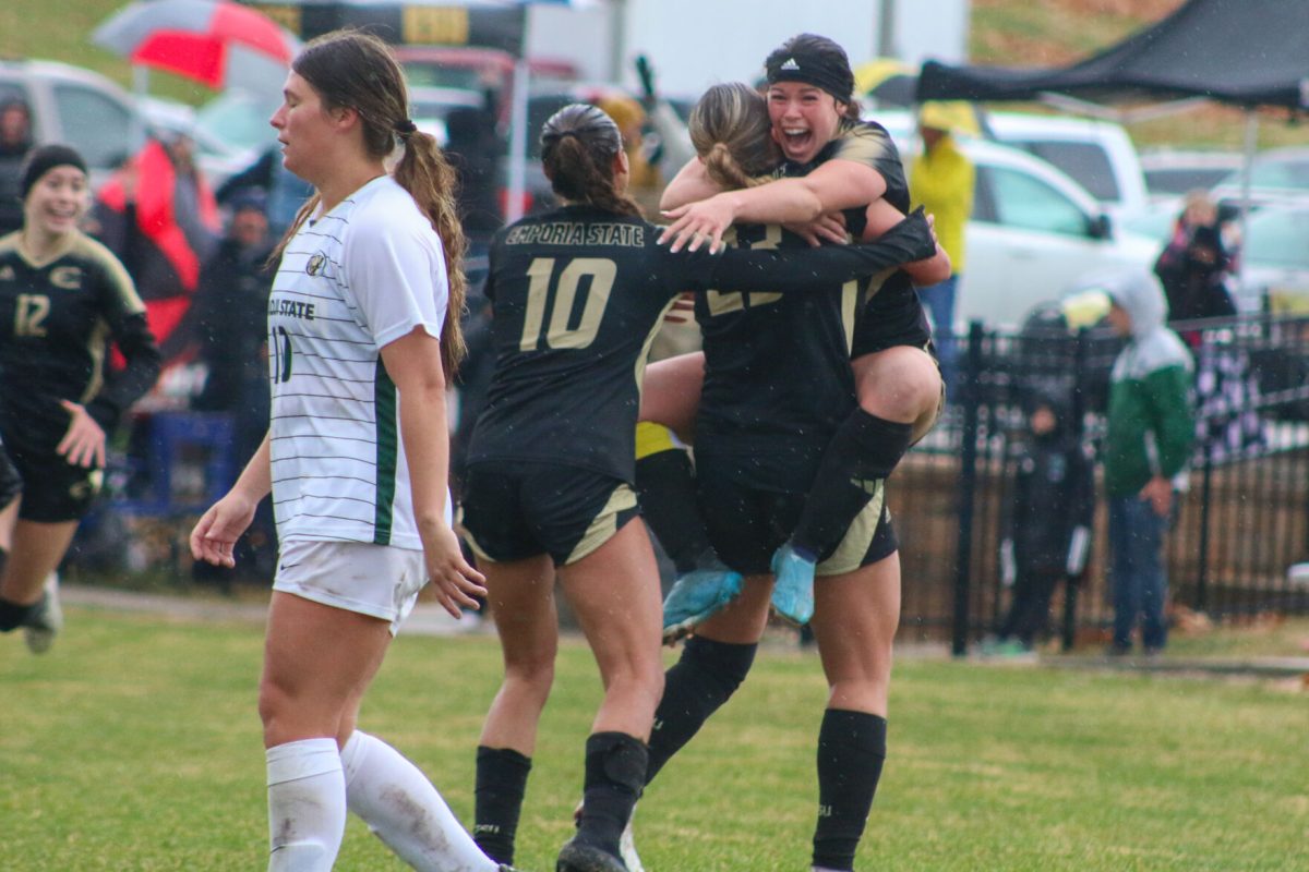 Graduate student defender Joanie Westcoat and head coach Bryan Sailer hug after time expired on the clock, putting the Hornets into the sweet sixteen.