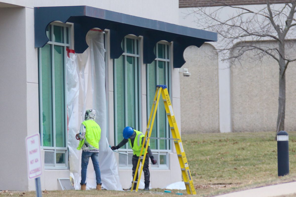 Construction crews are seen taping off sections along the west wall of the ESU recreation center on Feb. 16.
