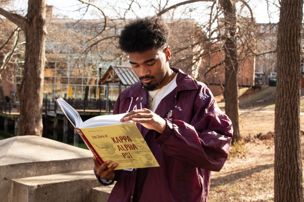 Guy Ramos, Kappa Alpha Psi president, is seen reading &#8220;The Story of Kappa Alpha Psi&#8221;, which is a comprehensive book on the fraternity&#8217;s history. All members are encouraged to read on the history of the fraternity.
