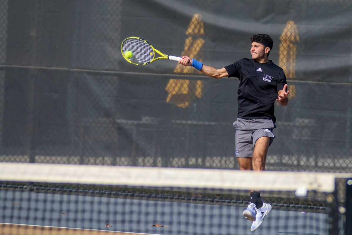 Freshman Mostafa Elbasnaly rallies the ball back to his Pratt opponent.