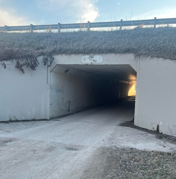 The campus woods tunnel provides little sight for drivers.
