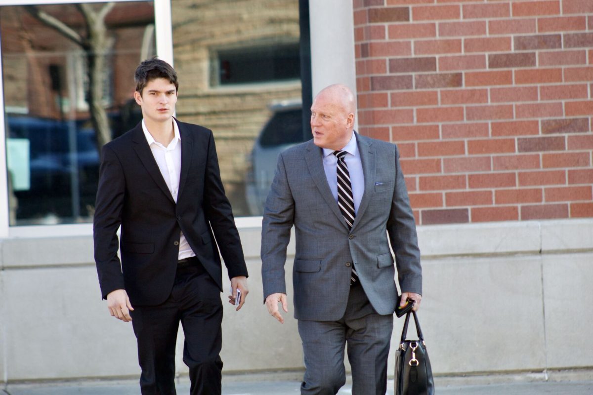 Dominik Simunovic is seen exiting the Lyon County Courthouse on Jan. 3, with his attorney, Frederick L. Meier, after pleading not guilty to alleged rape and attempted aggravated criminal sodomy.
