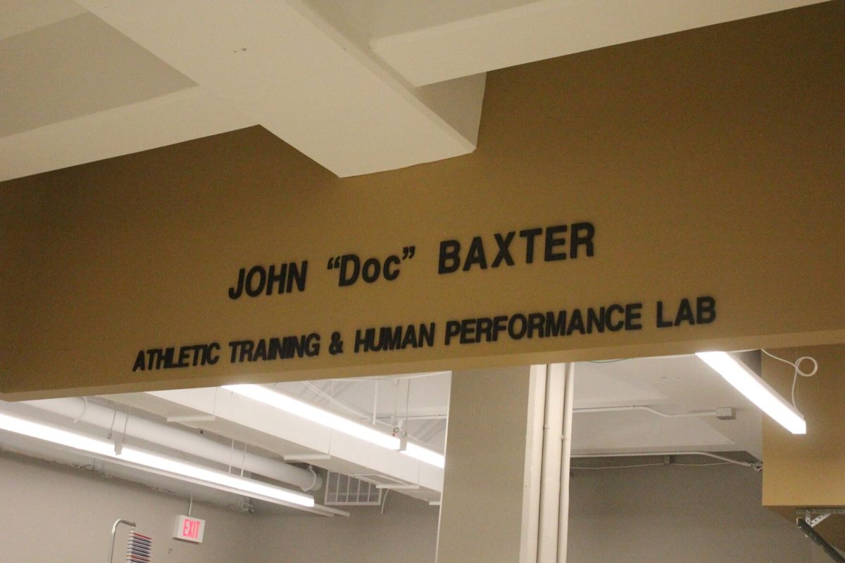 Newly hung sign honoring John &#8216;Doc&#8217; Baxter inside the performance lab on the main floor of HPER.&#160;