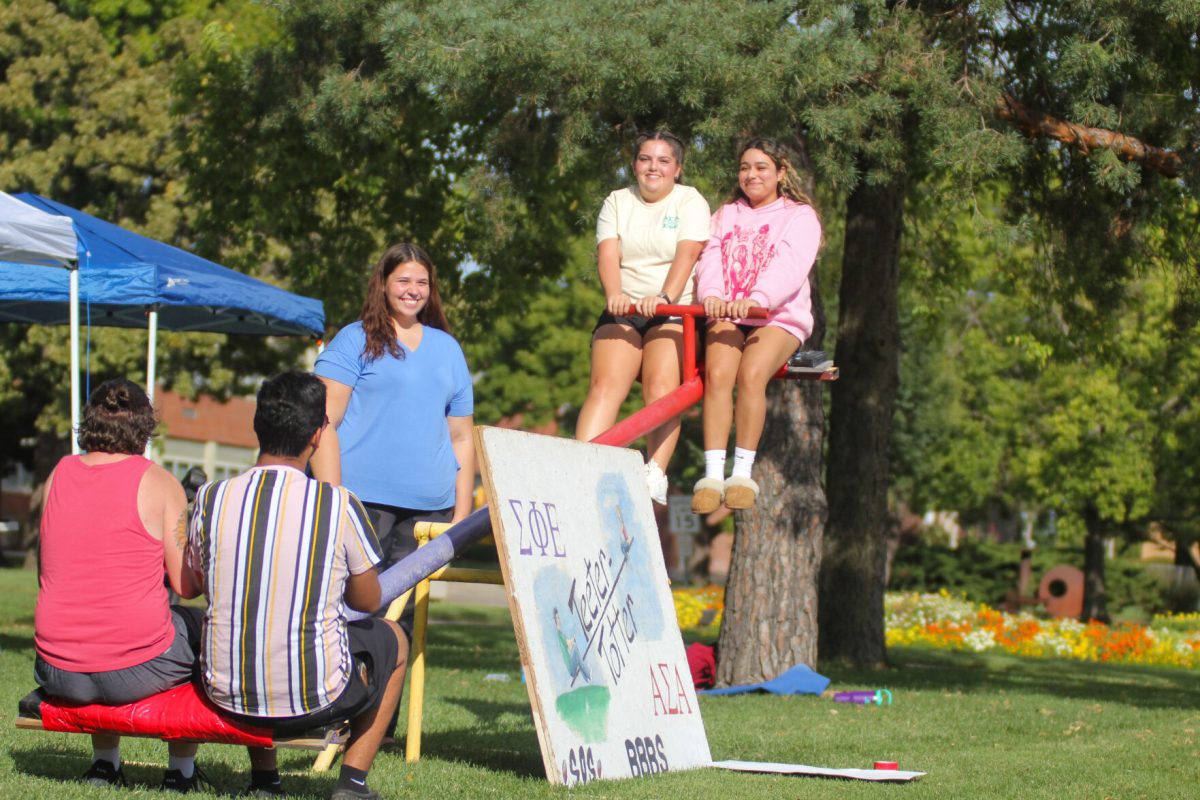 Members of the Alpha Sigma Alpha fraternity and Sigma Phi Epsilon fraternity participate in the Teeter Totter fundraising event on Sept. 27.&#160;