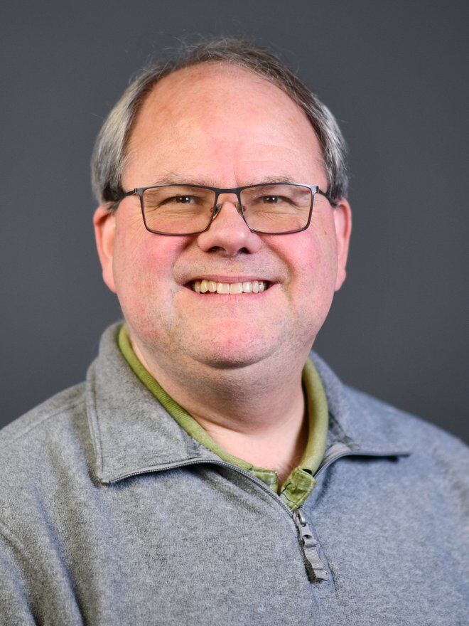 Michael Smith, 54, is a professor of political science and Acting President of the Current Club.