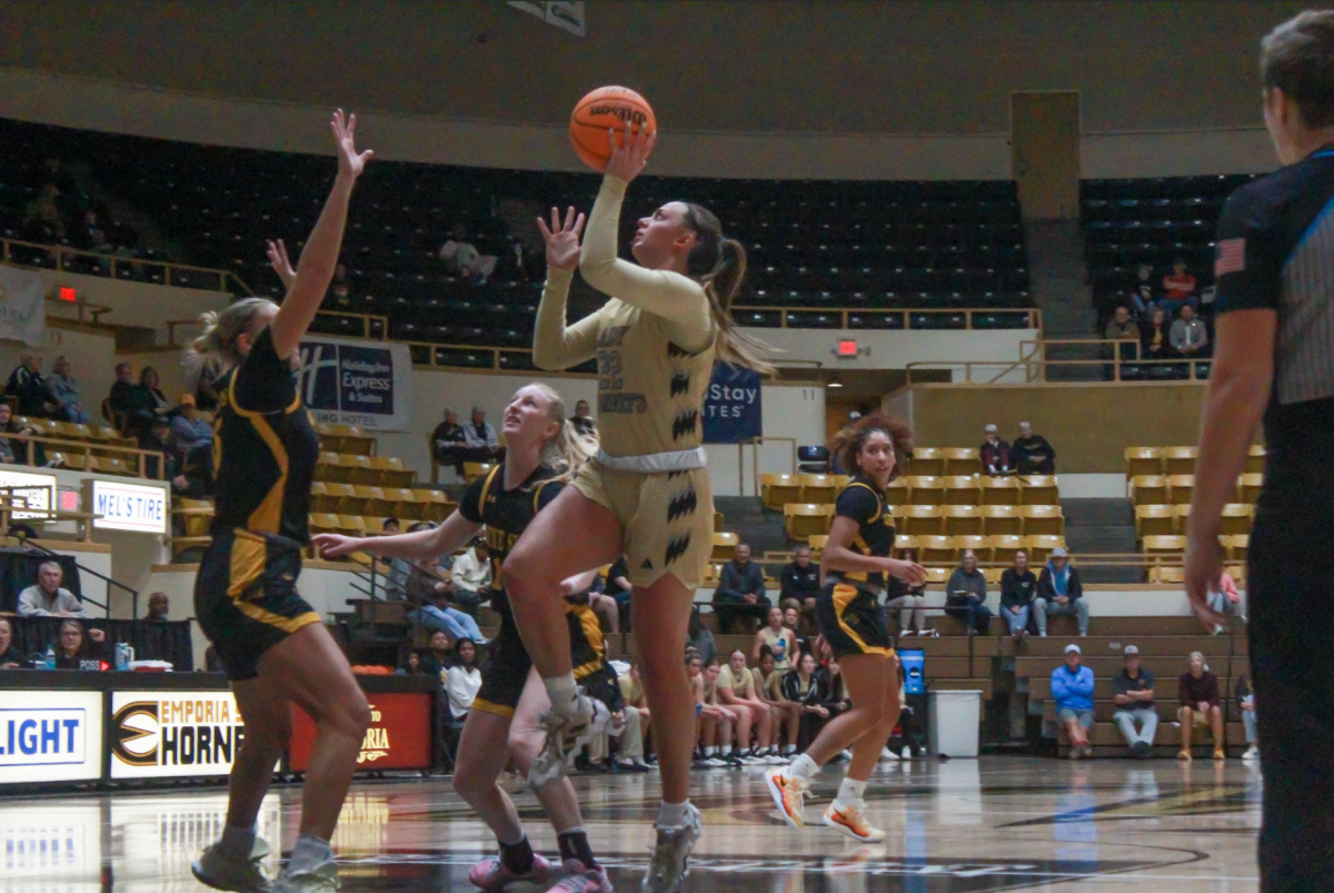 Graduate student forward Faith Paramore goes in for a layup during
the first half against Wayne State College on Nov. 13.