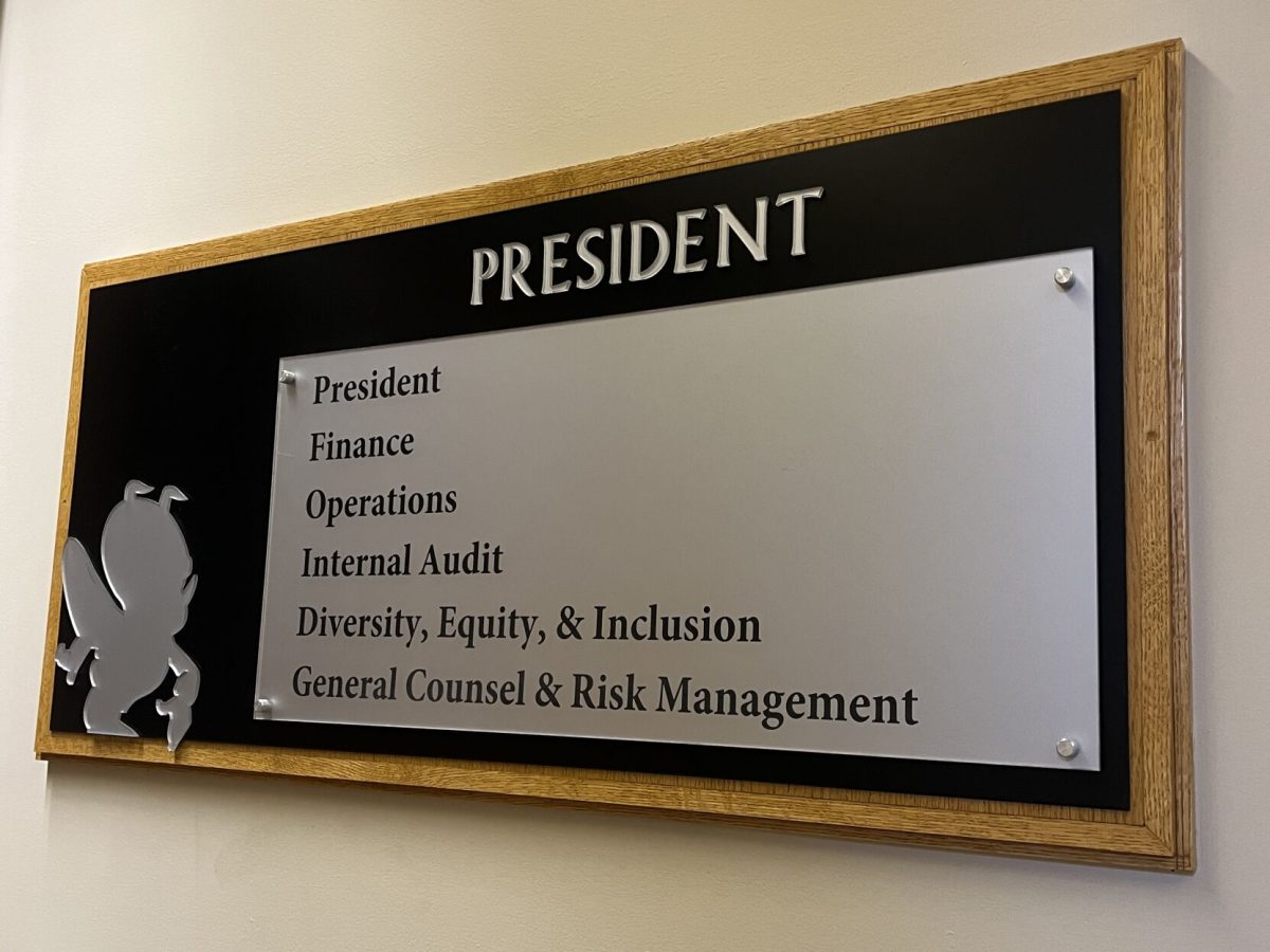 A navigation plaque mentioning the Division of Diversity, Equity and Inclusion outside of Emporia State's Office of the President on the second floor of Plumb Hall.&#160;