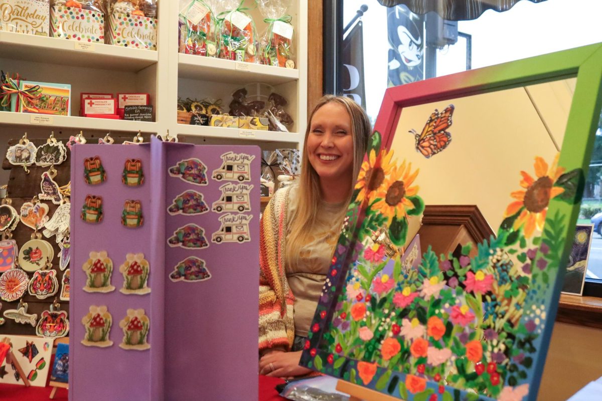 Hannah Worthen sets up her art booth inside the Sweet Granada located at 803 Commercial St. for September’s
First Friday Art Walk.