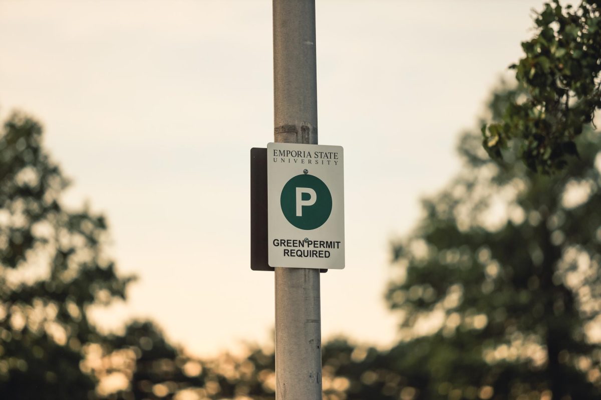 A “green permit required sign” posted in the parking lot outside of Abigail Morse Hall. Green permits are designated for students living on campus. 
