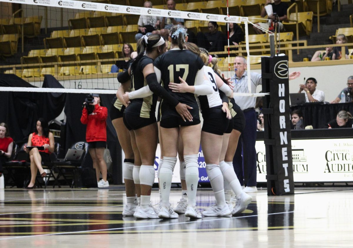 The Hornets huddle up in a set against the Central Missouri Jennies on Oct. 17. 