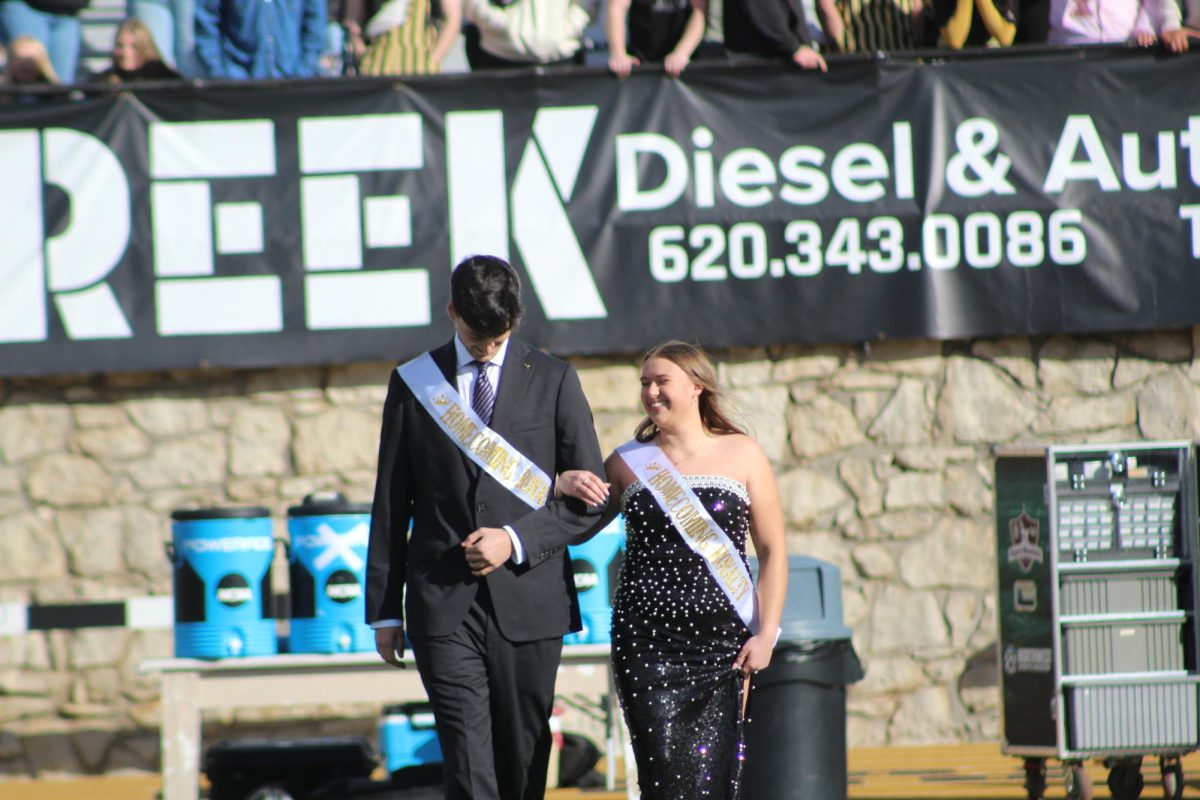 Nolan Giminez Wilson and Presley Johnson walk onto the field as their names are called. 

