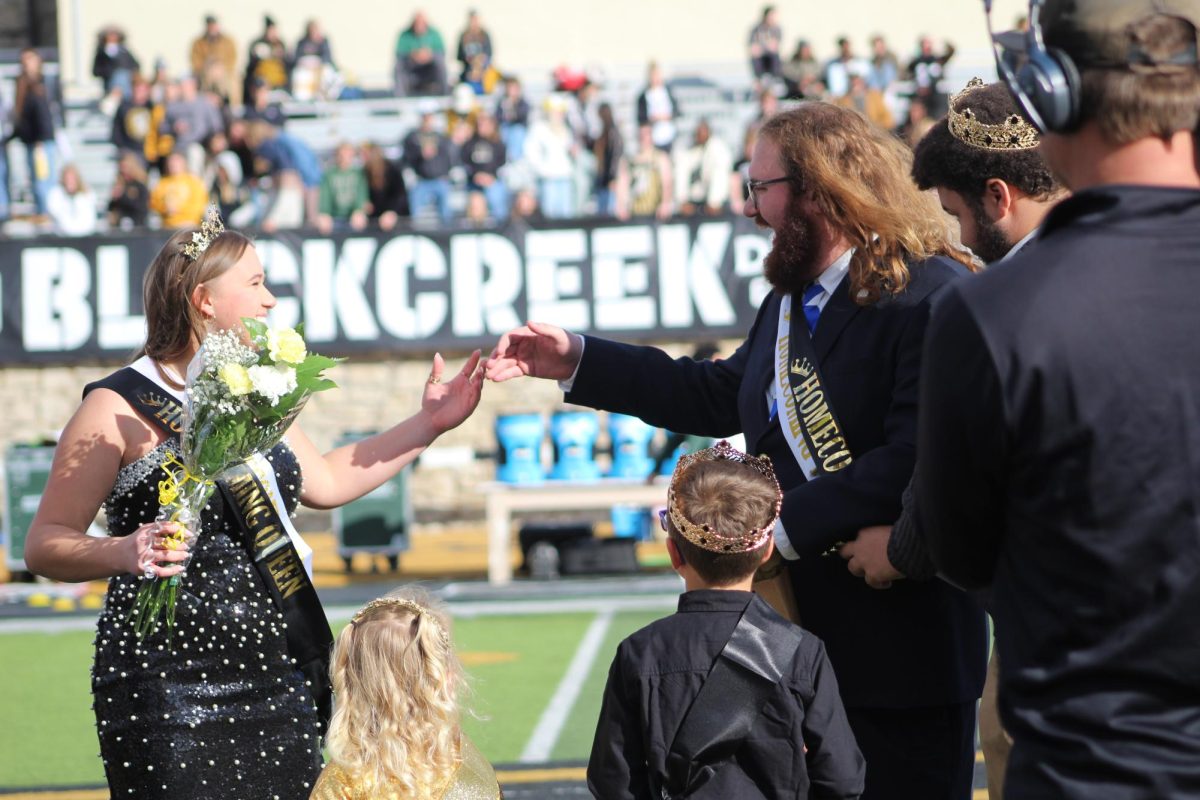 Presley Johnson and Maliki Mosher laugh as they are crowned Homecoming Queen and King during the halftime crowning ceremony. The 2025 Homecoming court also included Destyni Meadows, Anna Phillips, Nicole Blocker, Jane Hough, Nolan Giminez Wilson, Grant Yoder, Josh Manahan and Joel Franz. 