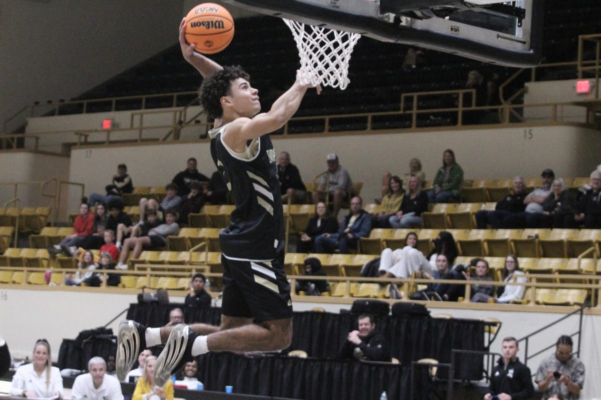 Trey Redd, senior guard for the Hornets,  at Late Night at White on Nov. 5. Redd earned a career high of 12 assists in play against Northwestern Oklahoma on Nov. 29.