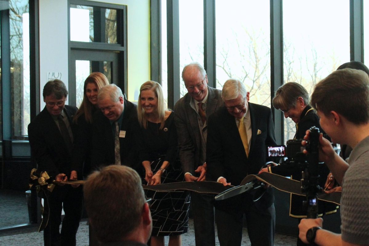 Interim Emporia State President Taylor Kriley, former ESU President Ken Hush and Kansas Governor Laura Kelly, among others cut the ribbon at a ceremony to commemorate the opening of the Nursing and Student Wellness Center on Jan. 22. 