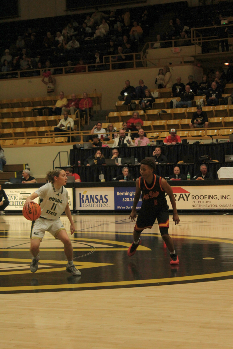 Graduate student Kaitlyn Sanders dribbles the ball in a game against Pitt State on Feb. 5. The close match up ended in a 65-63 win for ESU 
