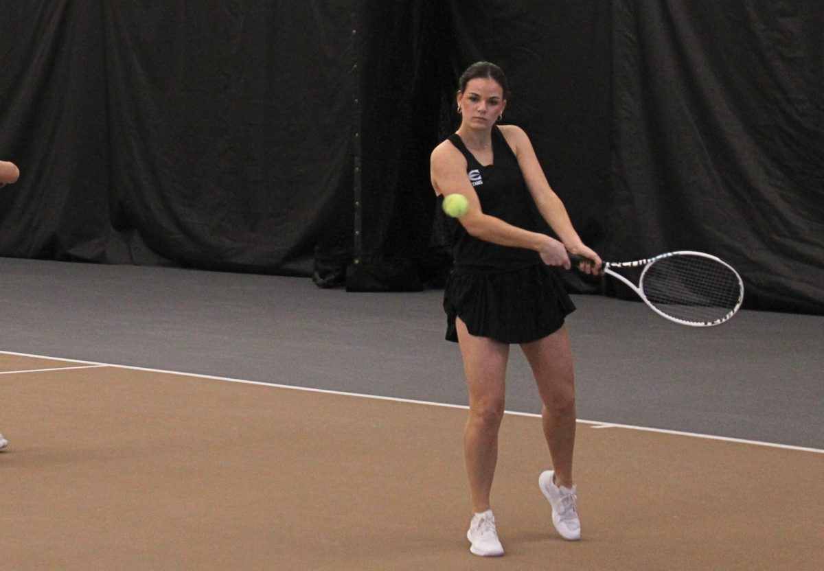 Freshman Carla Paul Piquer warms up before a No. 1 doubles match against Bethel on Feb. 6, played with doubles partner sophomore Yuliya Klimova. Paul Piquer went on to win a singles match later in the day and both her doubles and singles matches on Feb. 7 against Seward County Community College. 