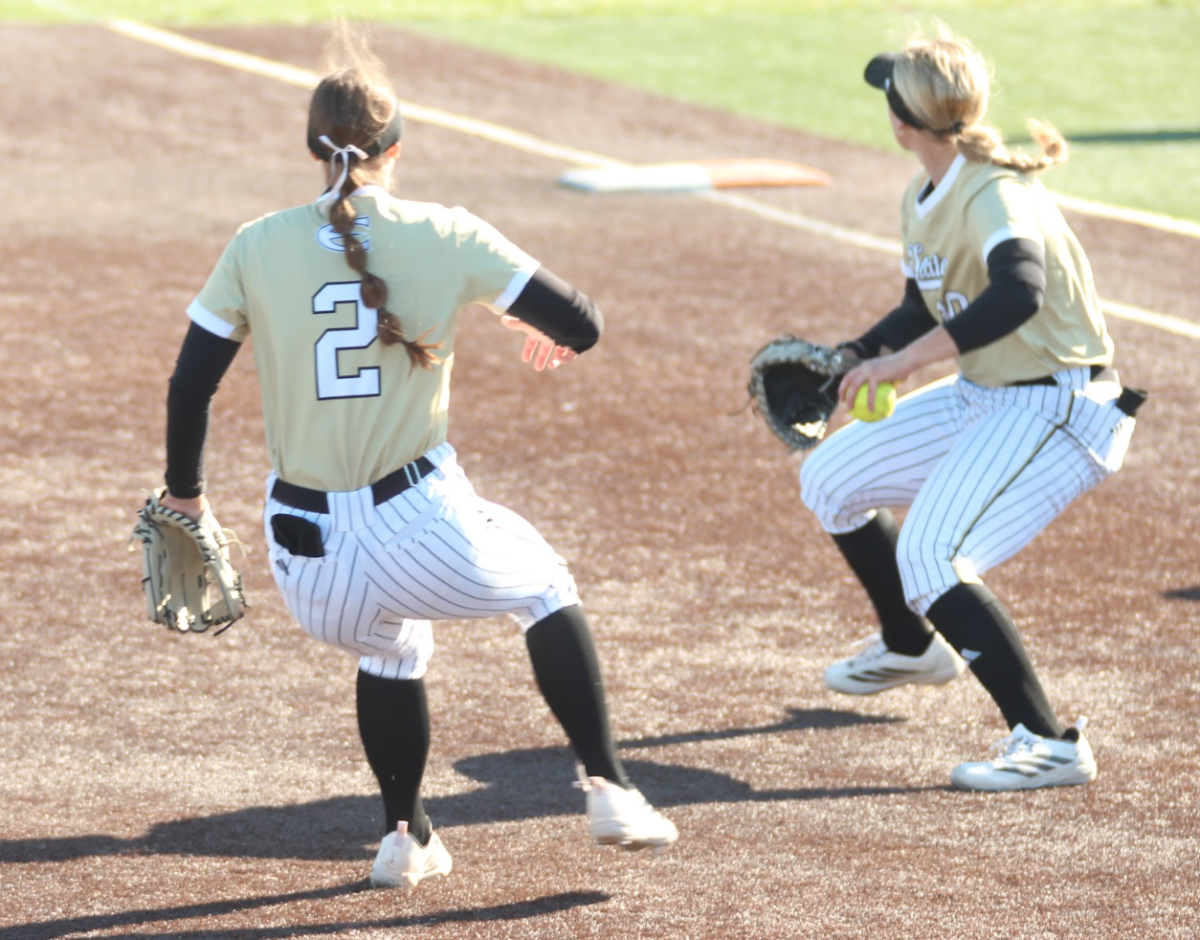 Junior infielder Brooke Flewelling covers junior infielder Avery Brewer as she eyes a throw in game two against the Gorillas. The Hornets fell 9-2. 