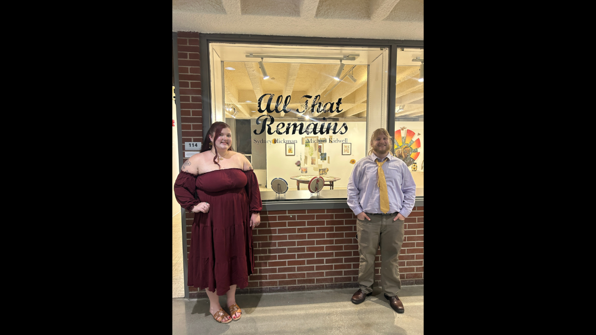 Bachelor of Fine Arts seniors Sydney Hickman and Michael Kidwell stand in front of Eppink Art Gallery for a photo during the opening reception of their senior show, All That Remains, on April 3. Photo courtesy of Sydney Hickman